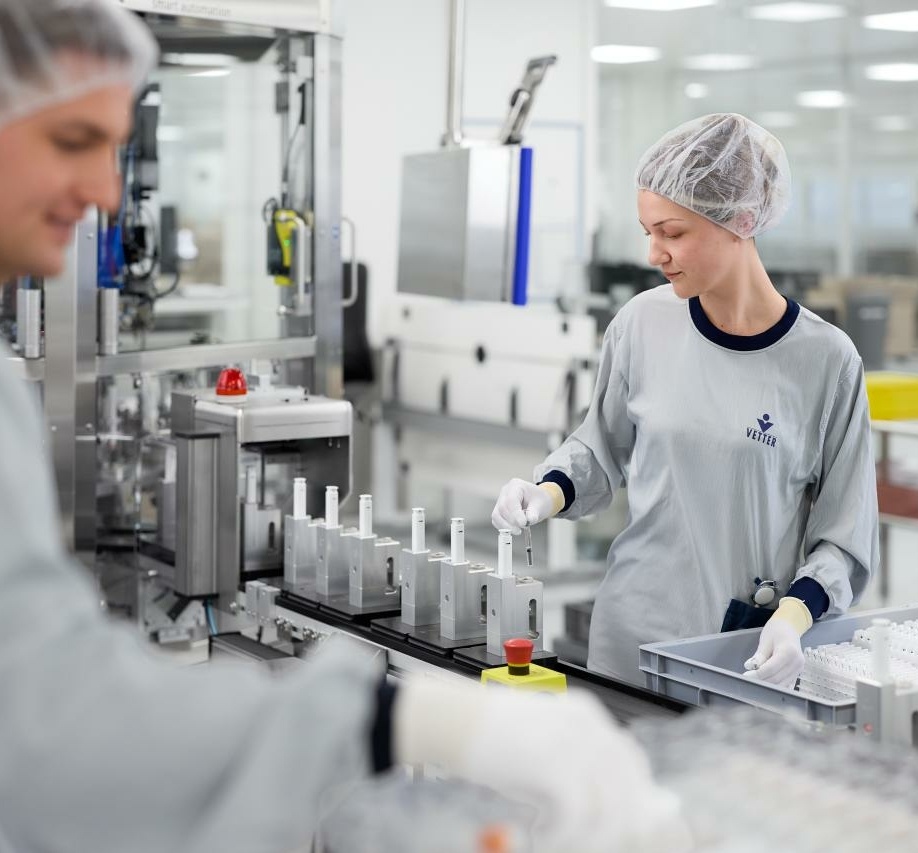 Woman assembles Autoinjector