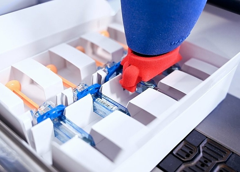 Assembled drug products being placed in secondary packaging