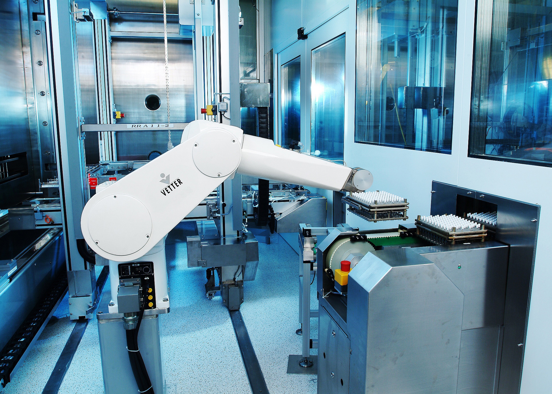 Robotic arm transports vials