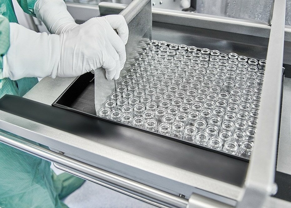 a batch of drug product vials being processed on a sterile fill finish line