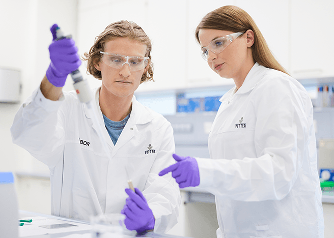 two lab workers in Quality control and analytical methods