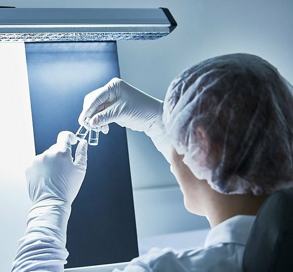 Man during manual visual inspection process