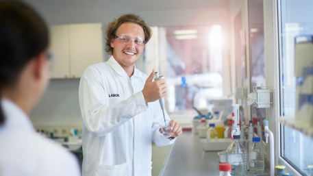 Man in white lab coat providing analytical services