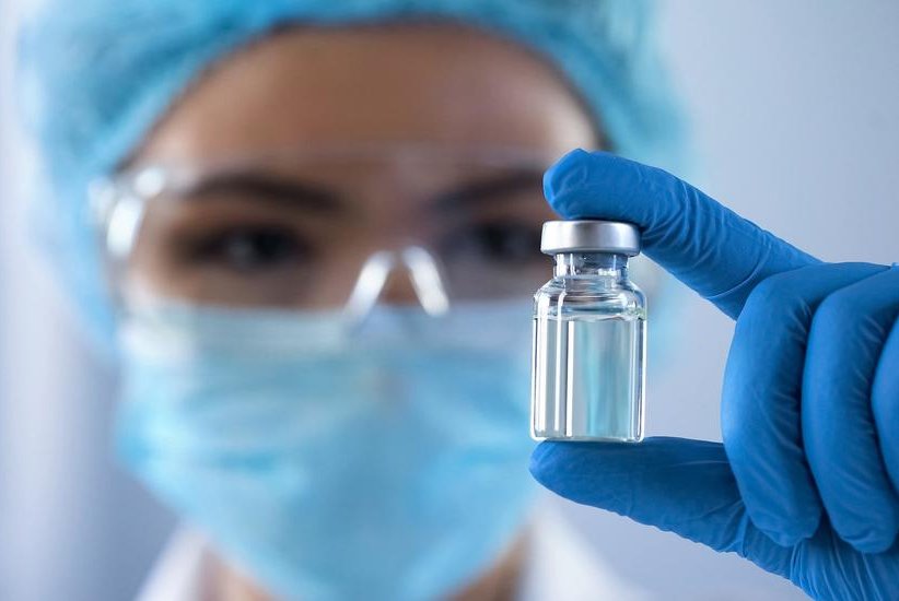 vial inspected by worker for clinical trials