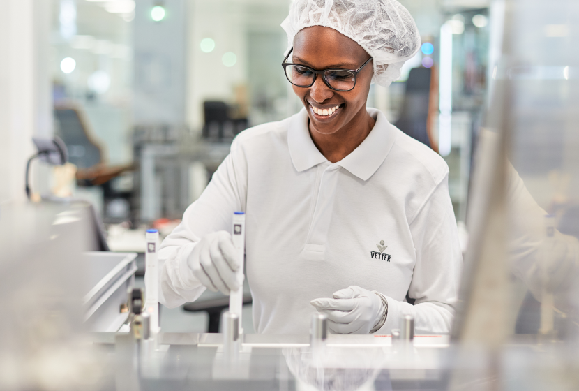 pharma worker at autoinjector assembly